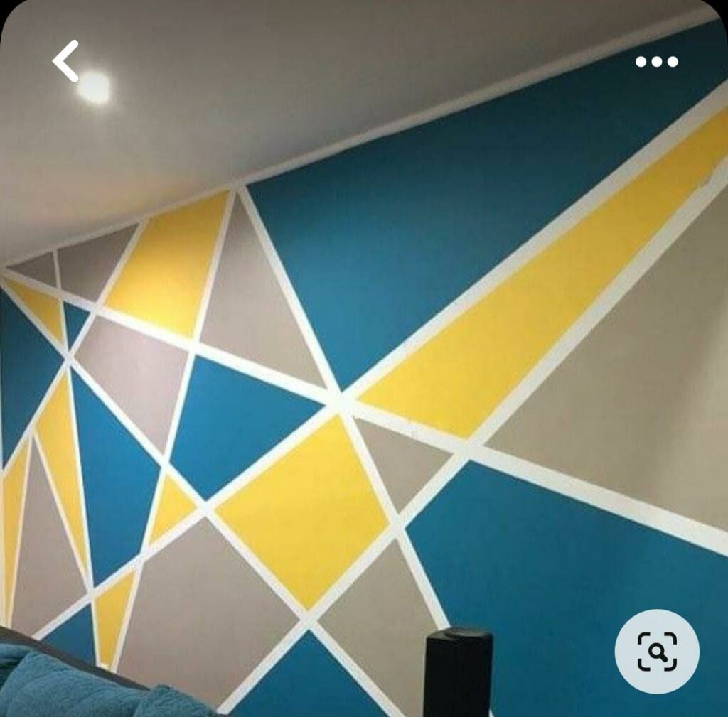 Colorful geometric shapes painted on a wall.