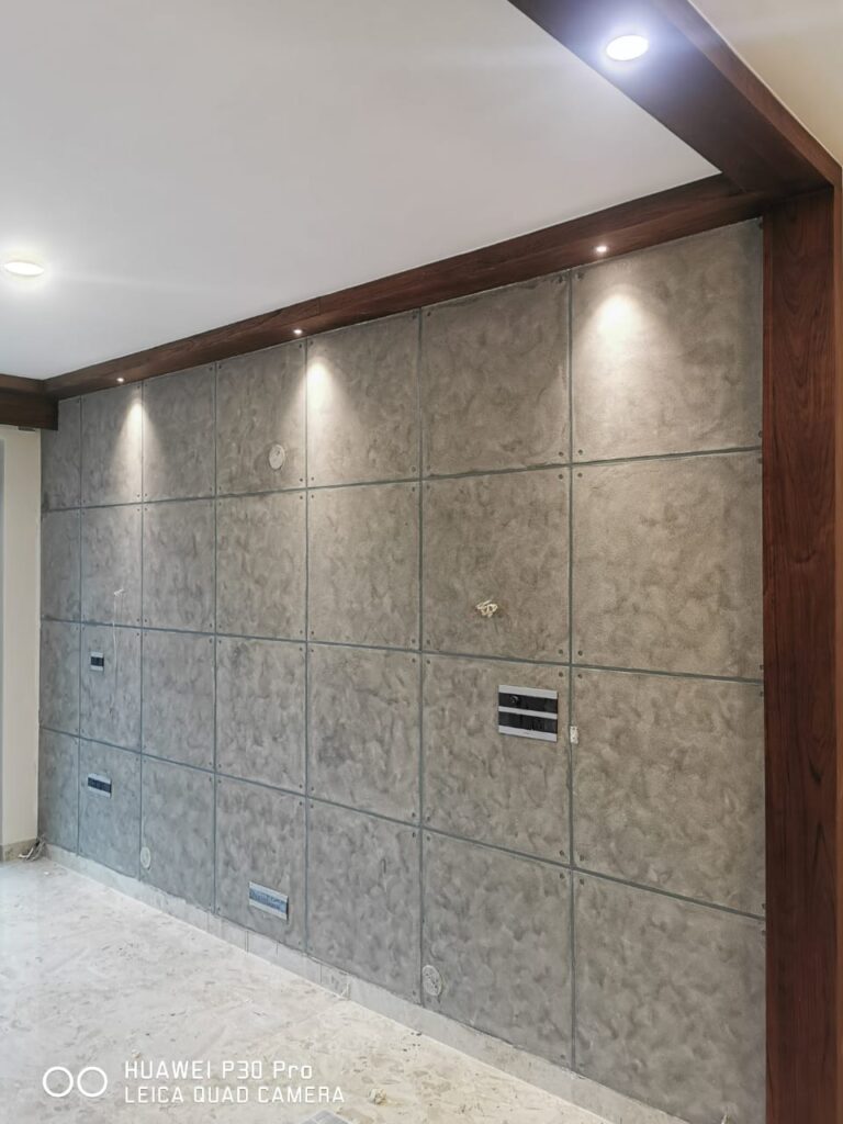 Interior room with concrete tile wall and wooden trim, creating a modern and warm aesthetic.